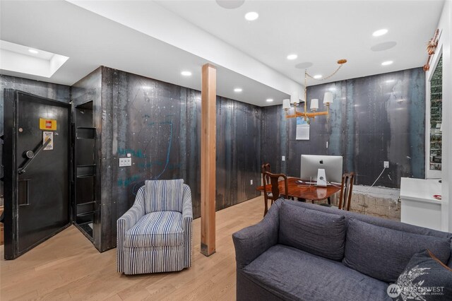 office space with recessed lighting and wood finished floors