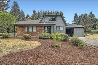 view of front of home with driveway and an attached garage
