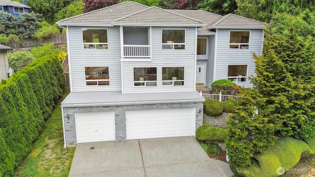 15428 SE 67th Pl, Bellevue, WA 98006 - view of front facade with an attached garage, driveway, and fence