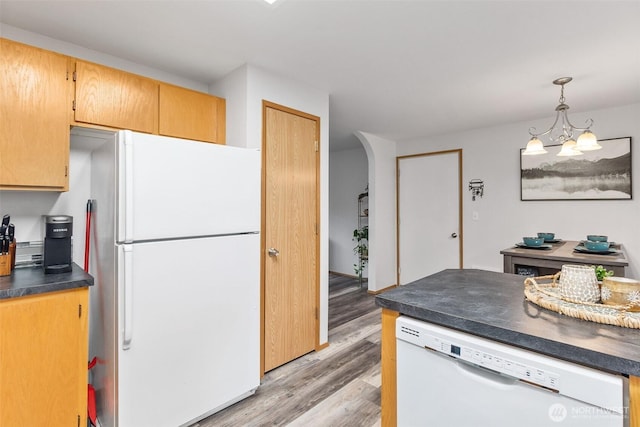 60 E Treewater Pl, Shelton, WA 98584 - kitchen with white appliances, dark countertops, light wood-type flooring, a chandelier, and hanging light fixtures