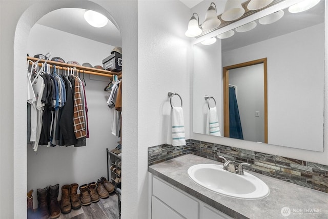 60 E Treewater Pl, Shelton, WA 98584 - full bath with a spacious closet, vanity, and decorative backsplash