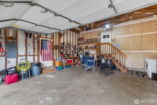 60 E Treewater Pl, Shelton, WA 98584 - garage featuring a garage door opener, electric panel, and washer / dryer