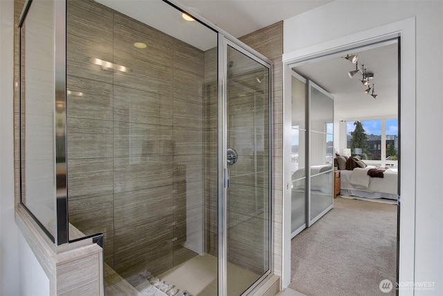 full bathroom featuring ensuite bath and a shower stall