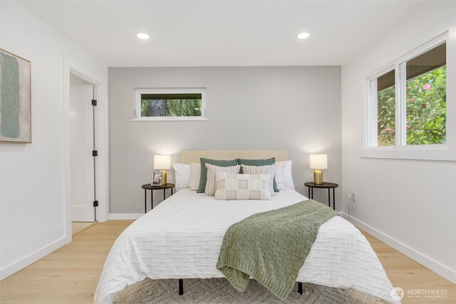 bedroom with light wood-style flooring, baseboards, and recessed lighting