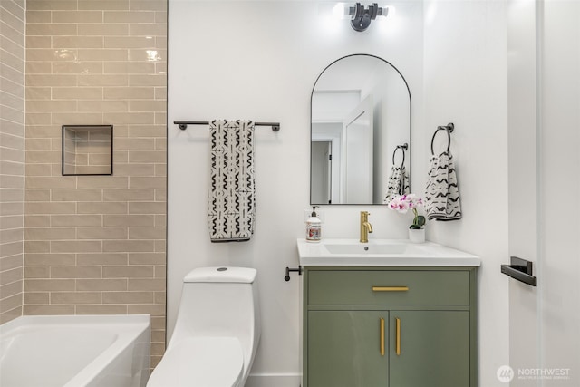 bathroom featuring toilet and vanity
