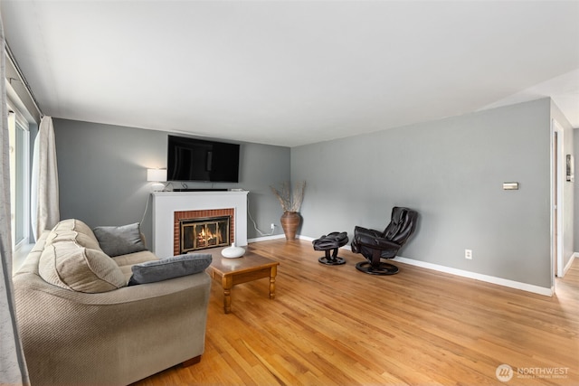 8511 31st St W, University Place, WA 98466 - living area with light wood-style floors, a brick fireplace, and baseboards