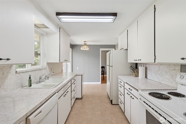 8511 31st St W, University Place, WA 98466 - kitchen with white appliances, a sink, light countertops, white cabinets, and tasteful backsplash