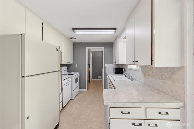 8511 31st St W, University Place, WA 98466 - kitchen featuring white appliances, a sink, light countertops, tasteful backsplash, and baseboards