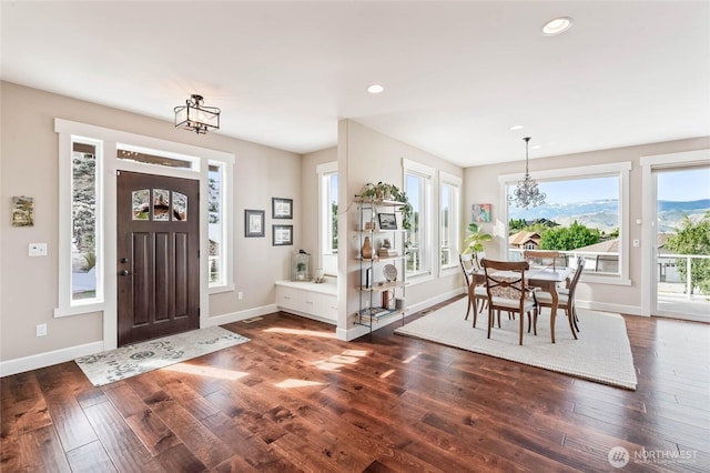 719 19th St NE, East Wenatchee, WA 98802 - foyer entrance featuring a chandelier, baseboards, wood finished floors, and recessed lighting