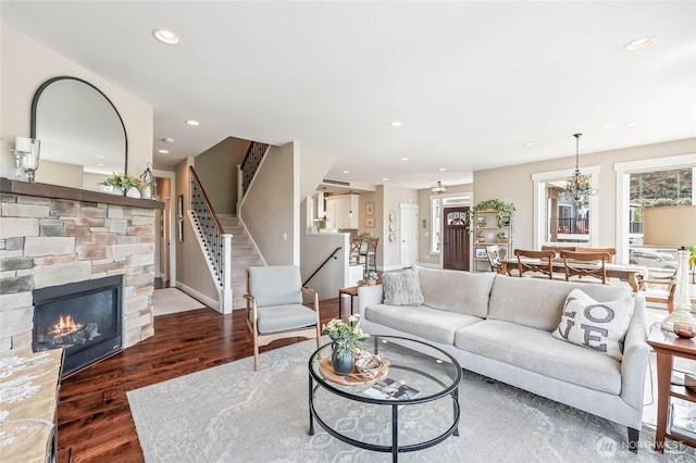 719 19th St NE, East Wenatchee, WA 98802 - living room with stairway, wood finished floors, recessed lighting, baseboards, and a fireplace