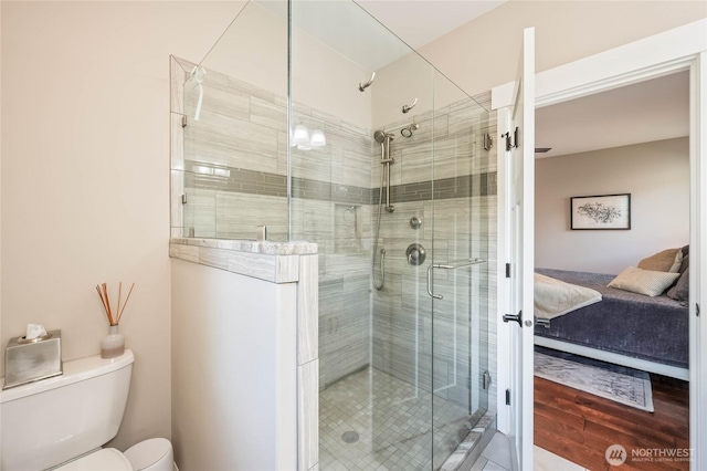 719 19th St NE, East Wenatchee, WA 98802 - bathroom featuring toilet, a stall shower, and connected bathroom