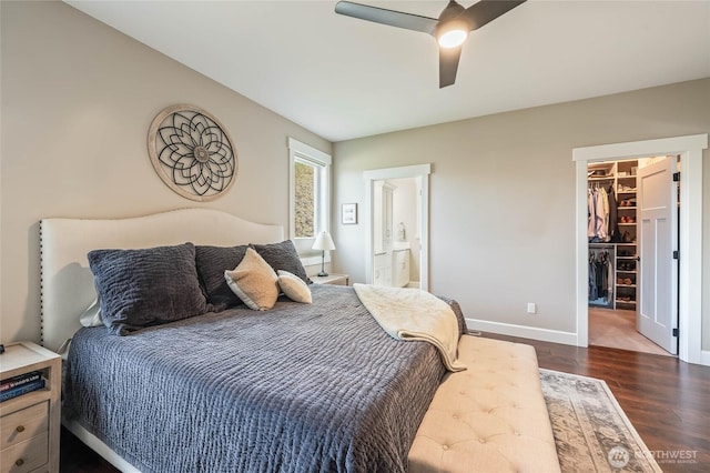 719 19th St NE, East Wenatchee, WA 98802 - bedroom featuring a spacious closet, dark wood-type flooring, baseboards, a closet, and ensuite bathroom