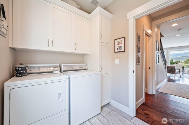 719 19th St NE, East Wenatchee, WA 98802 - clothes washing area featuring separate washer and dryer, cabinet space, baseboards, light wood-style flooring, and recessed lighting