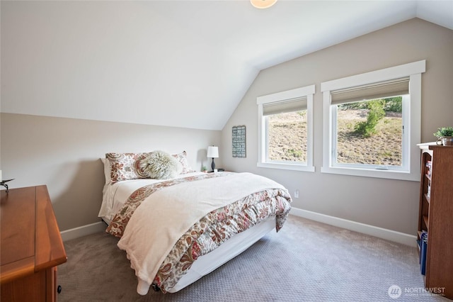 719 19th St NE, East Wenatchee, WA 98802 - bedroom with vaulted ceiling, carpet, and baseboards