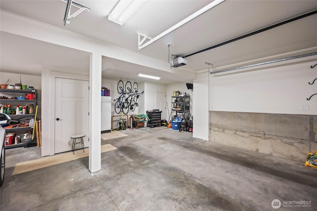 719 19th St NE, East Wenatchee, WA 98802 - garage featuring a garage door opener