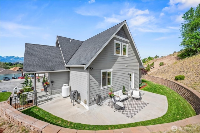 719 19th St NE, East Wenatchee, WA 98802 - back of property with a patio, roof with shingles, and fence