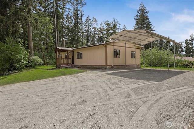 23920 50th Ave E, Graham, WA 98338 - exterior space featuring a carport, crawl space, and dirt driveway