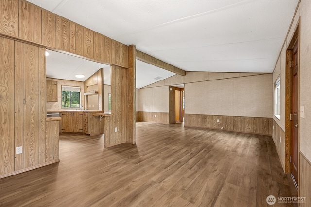 23920 50th Ave E, Graham, WA 98338 - unfurnished living room with wood walls, wood finished floors, and a sink