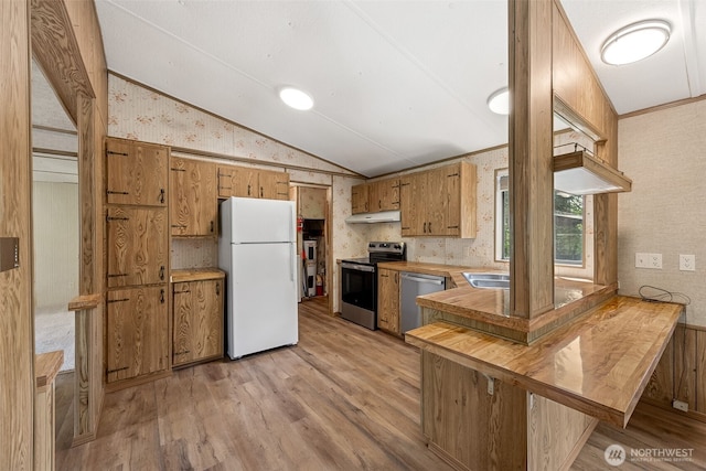 23920 50th Ave E, Graham, WA 98338 - kitchen featuring appliances with stainless steel finishes, wallpapered walls, lofted ceiling, under cabinet range hood, and light wood finished floors