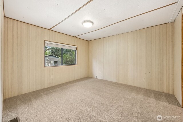 23920 50th Ave E, Graham, WA 98338 - carpeted empty room featuring wood walls