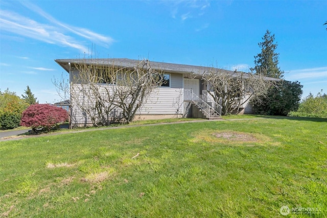 ranch-style house featuring a front lawn