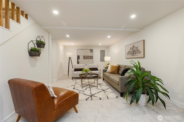 carpeted living room featuring baseboards and recessed lighting