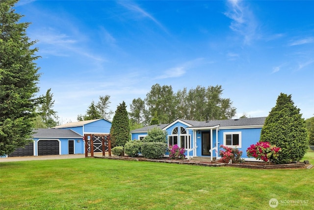 7135 W 40th Dr, Ferndale, WA 98248 - ranch-style house featuring a front yard, an attached garage, an outdoor structure, and driveway