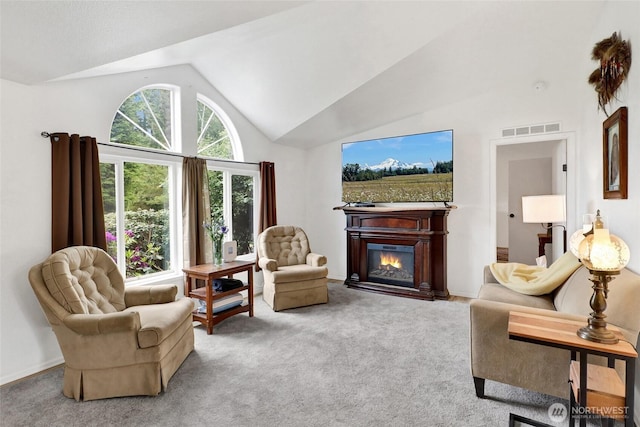 7135 W 40th Dr, Ferndale, WA 98248 - carpeted living room featuring lofted ceiling and a glass covered fireplace