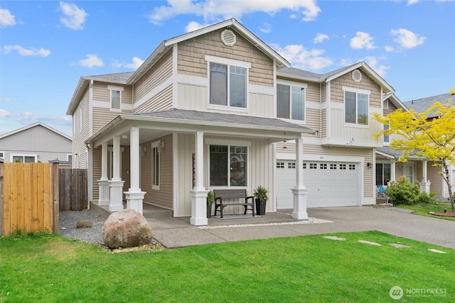 9604 201st Street Ct E, Graham, WA 98338 - view of front of property featuring covered porch, asphalt driveway, an attached garage, and board and batten siding