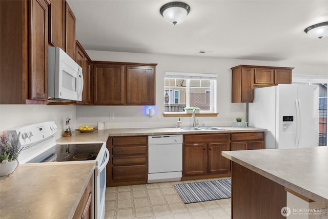 9604 201st Street Ct E, Graham, WA 98338 - kitchen with white appliances, light flooring, and light countertops