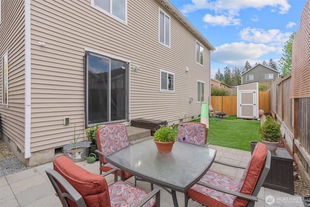9604 201st Street Ct E, Graham, WA 98338 - fenced backyard with a patio area, outdoor dining area, and a storage shed