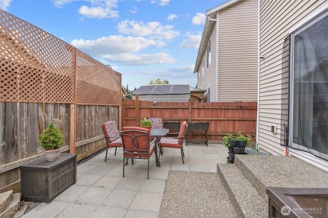 9604 201st Street Ct E, Graham, WA 98338 - fenced backyard featuring a patio area and outdoor dining area