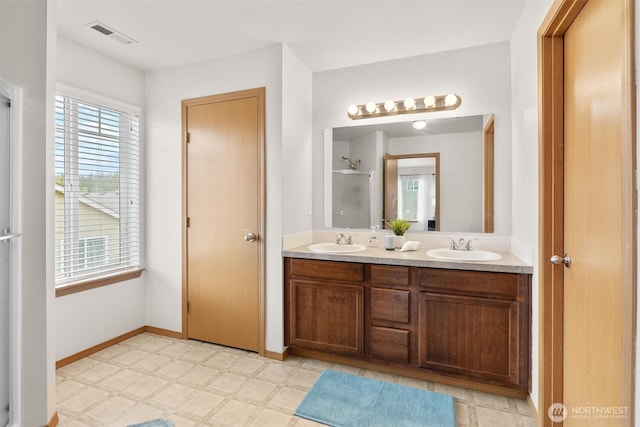 9604 201st Street Ct E, Graham, WA 98338 - full bathroom with double vanity, a shower with shower door, and tile patterned floors