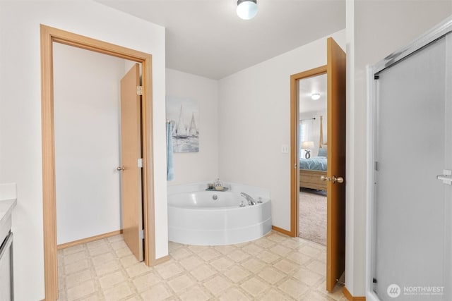 9604 201st Street Ct E, Graham, WA 98338 - ensuite bathroom featuring tile patterned floors, a garden tub, and vanity