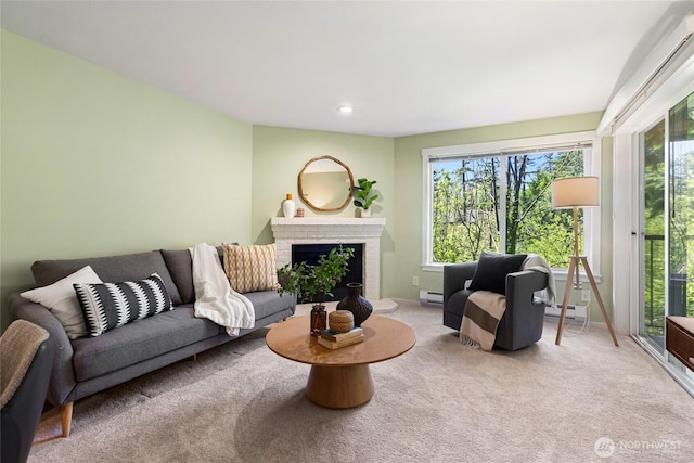 11307 NE 128th St Unit G204, Kirkland, WA 98034 - carpeted living area featuring baseboard heating, plenty of natural light, a brick fireplace, and recessed lighting