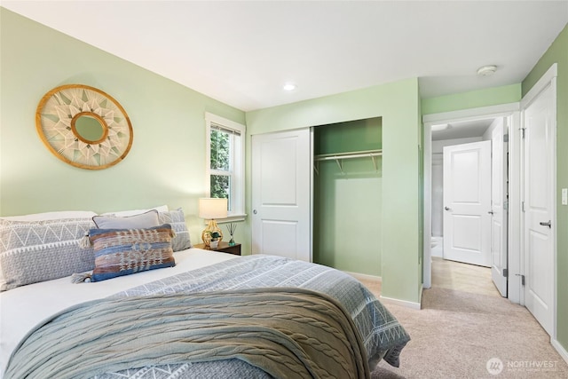 11307 NE 128th St Unit G204, Kirkland, WA 98034 - bedroom with light carpet, a closet, baseboards, and recessed lighting