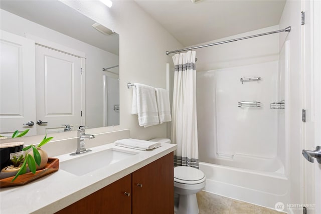 11307 NE 128th St Unit G204, Kirkland, WA 98034 - bathroom featuring vanity, shower / bath combo, toilet, and tile patterned floors