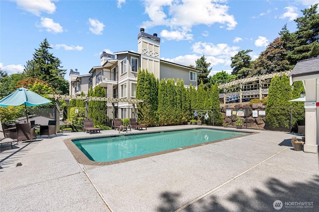 11307 NE 128th St Unit G204, Kirkland, WA 98034 - community pool featuring a patio area