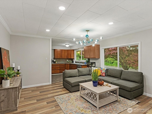 28611 139th Ave NE, Arlington, WA 98223 - living area with ornamental molding, light wood-style floors, baseboards, and recessed lighting