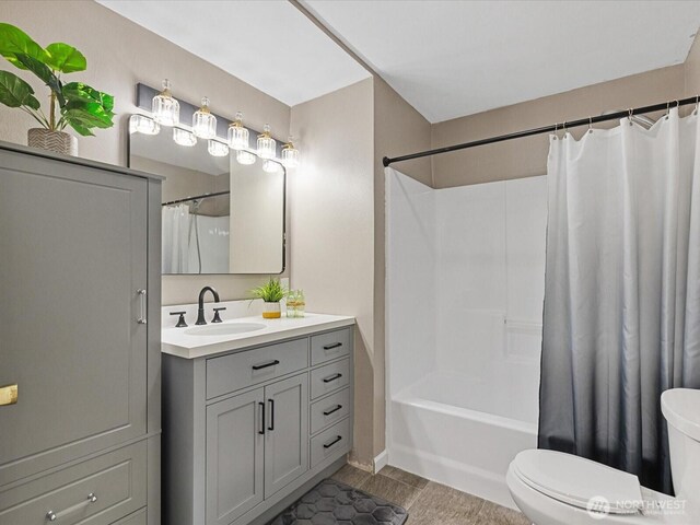 28611 139th Ave NE, Arlington, WA 98223 - bathroom with toilet, vanity, shower / tub combo, and baseboards