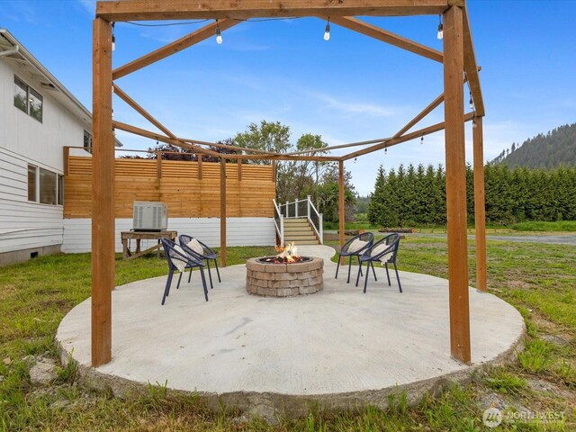 28611 139th Ave NE, Arlington, WA 98223 - view of patio / terrace featuring a fire pit and central AC