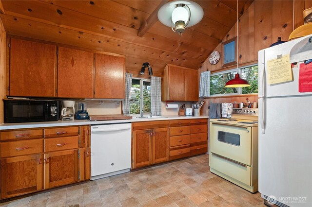 11194 S Lakeshore Rd, Chelan, WA 98816 - kitchen featuring white appliances, brown cabinetry, light countertops, healthy amount of natural light, and wood ceiling