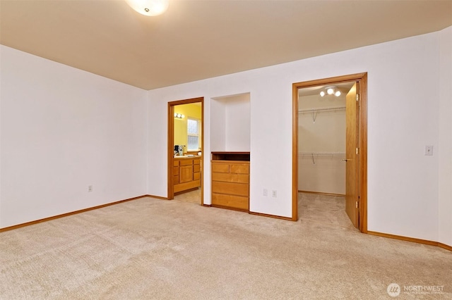 520 W Summer Breeze Ln, Sequim, WA 98382 - unfurnished bedroom with light carpet, baseboards, a spacious closet, connected bathroom, and a closet