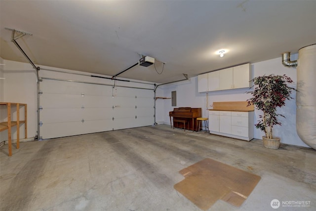 520 W Summer Breeze Ln, Sequim, WA 98382 - garage featuring a garage door opener and electric panel