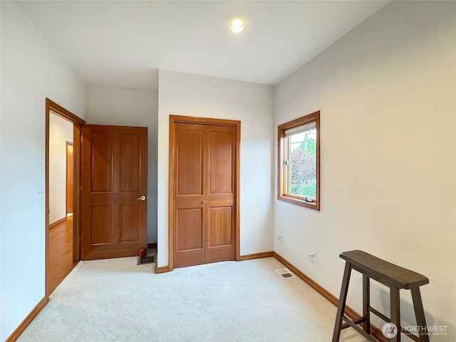 706 W 4th St, Port Angeles, WA 98363 - unfurnished bedroom with baseboards, light carpet, a closet, and recessed lighting