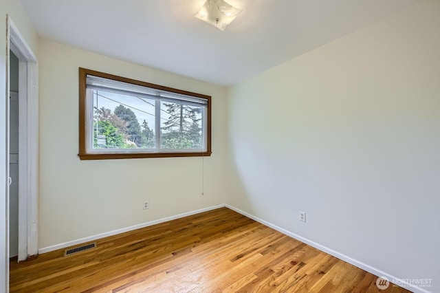 1204 S 229th St, Des Moines, WA 98198 - unfurnished bedroom with baseboards and light wood-style floors