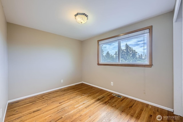1204 S 229th St, Des Moines, WA 98198 - empty room featuring baseboards and light wood-style flooring