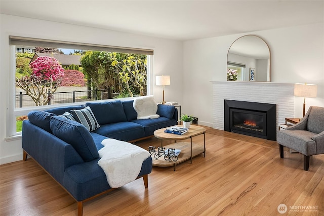 12515 2nd Ave NW, Seattle, WA 98177 - living area with plenty of natural light, light wood-type flooring, and a glass covered fireplace