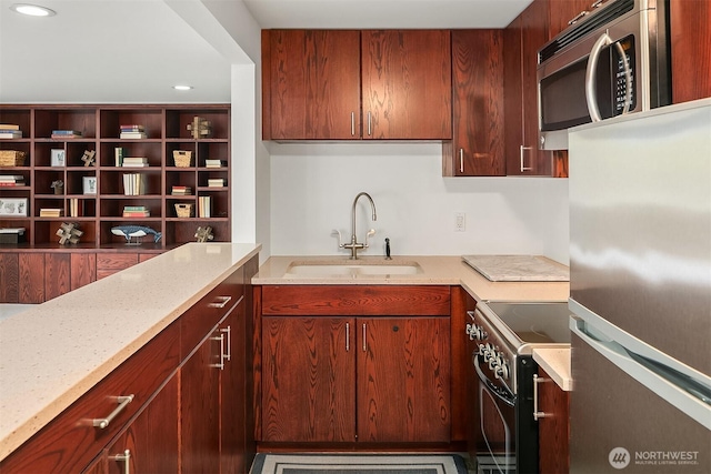 12515 2nd Ave NW, Seattle, WA 98177 - kitchen with a sink, stainless steel appliances, recessed lighting, and light stone countertops