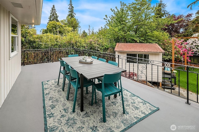 12515 2nd Ave NW, Seattle, WA 98177 - view of patio / terrace featuring an outdoor structure, outdoor dining area, and a shed
